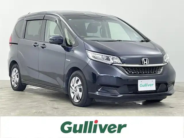 ホンダ フリード ハイブリット G ホンダセンシング 千葉県 2020(令2)年 5.9万km ミッドナイトブルービームM 禁煙車/ホンダセンシング/・衝突軽減ブレーキ/・誤発進抑制機能/・歩行者事故低減ステアリング/・路外逸脱抑制機能/・アダプティブクルーズコントロール/・標識認識機能/両側パワースライドドア/純正10インチナビ/Bluetooth/CD/DVD/フルセグ/バックカメラ/レーダークルーズコントロール/LEDオートライト/シートヒーター/USBポート/プッシュスタート/スマートキー/取扱説明書/保証書