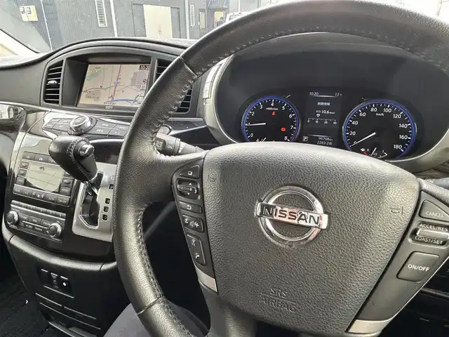 日産 エルグランド 250ハイウェイスターS 長崎県 2016(平28)年 9.7万km ブリリアントホワイトパール NISMOエアロ（F/S/R下）/純正ナビ/（CD/DVD/BT/フルセグ）/フリップダウンモニター/全方位カメラ/コーナーセンサー/クルーズコントロール/ETC/両側パワースライドドア/ハーフレザーシート/オートライト/NISMO18インチAW