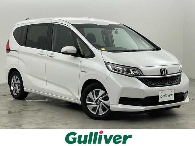 ホンダ フリード ハイブリット G ホンダセンシング 福岡県 2021(令3)年 3万km プラチナホワイトパール 純正ナビ（フルセグＴＶ）　/バックカメラ　/ビルトインＥＴＣ　/前方ドラレコ　/ＡＣＣ　/ホンダセンシング　/衝突被害軽減ブレーキ　/レーンキープ　/両側電動スライドドア　/シートヒーター　/ステアリングリモコン　/ＬＥＤ