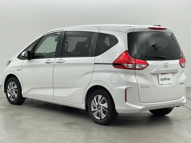 ホンダ フリード ハイブリット G ホンダセンシング 福岡県 2021(令3)年 3万km プラチナホワイトパール 純正ナビ（フルセグＴＶ）　/バックカメラ　/ビルトインＥＴＣ　/前方ドラレコ　/ＡＣＣ　/ホンダセンシング　/衝突被害軽減ブレーキ　/レーンキープ　/両側電動スライドドア　/シートヒーター　/ステアリングリモコン　/ＬＥＤ