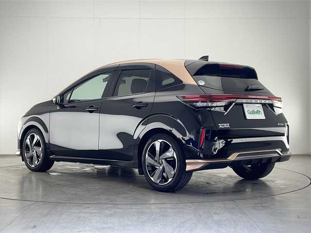 日産 オーラ G レザーエディション 宮崎県 2022(令4)年 4.4万km ミッドナイトブラック/サンライズカッパー 禁煙車/エマージェンシーブレーキ/純正9型ディスプレイオーディオナビTV/（高解像度モニター/Bluetooth/USB/HDMI/フルセグTV)/純正BOSEサウンドシステム/純正ドライブレコーダー/純正ビルトイン2.0ETC/純正LEDオートライト/純正LEDフォグ/純正17インチアルミ/純正フロアマット/黒本革シート/プロパイロット/アラウンドビューモニター/クリアランスソナー/ブラインドスポットモニター/スマートルームミラー/電子パーキング/オートホールド/オートエアコン/本革巻ハンドル/インテリジェントキー/プッシュエンジンスタート/スペアキー/新車時保証書/取扱い説明書