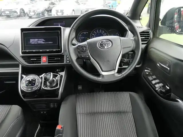 トヨタ ヴォクシー ハイブリッド ZS 煌 千葉県 2018(平30)年 5.6万km イナズマスパーキングブラックガラスフレーク Toyota Safety Sense/・プリクラッシュセーフティ/・レーンディパーチャーアラート/・オートハイビーム/クルーズコントロール/左オートステップ/両側パワースライドドア/純正SDナビ/地デジTV/【DVD/CD再生機能　Bluetooth接続】/バックカメラ/革巻きステアリング/ステアリングスイッチ/前席シートヒーター/ETC/LEDヘッドライト/ウインカーミラー/純正16インチアルミホイル/スマートキー