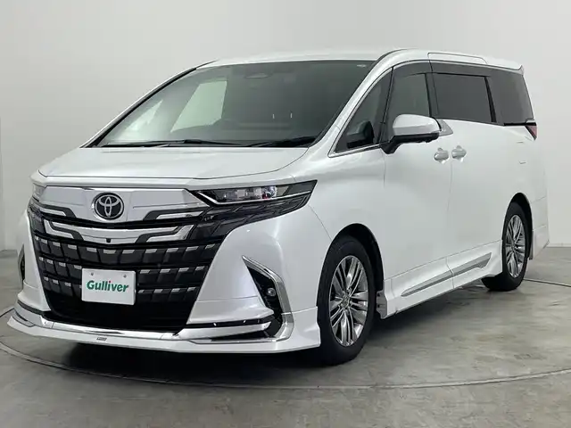 トヨタ アルファード Z 群馬県 2023(令5)年 1.9万km プラチナホワイトパールマイカ ・純正１４インチディスプレイオーディオ＜フルセグTV＞/・バック/サイドカメラ/・両側パワースライドドア/・前後ドライブレコーダー/・シートヒーター /・エアシート/・オットマン/・レーンアシスト /・横滑り防止装置/・盗難防止装置/・ABS/・オートライト/・オートマチックハイビーム/・純正フロアマット/・モデリスタエアロ/マフラー/・LEDヘッドライト/・純正１８インチアルミホイール
