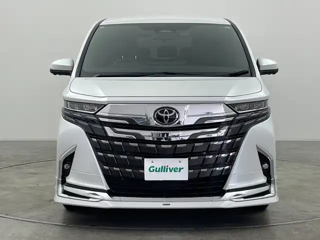 トヨタ アルファード Z 群馬県 2023(令5)年 1.9万km プラチナホワイトパールマイカ ・純正１４インチディスプレイオーディオ＜フルセグTV＞/・バック/サイドカメラ/・両側パワースライドドア/・前後ドライブレコーダー/・シートヒーター /・エアシート/・オットマン/・レーンアシスト /・横滑り防止装置/・盗難防止装置/・ABS/・オートライト/・オートマチックハイビーム/・純正フロアマット/・モデリスタエアロ/マフラー/・LEDヘッドライト/・純正１８インチアルミホイール