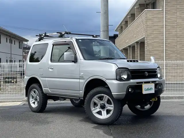 スズキ ジムニー XC 福島県 2015(平27)年 11.1万km シルキーシルバーメタリック ワンオーナー/パートタイム4WD/社外オーディオ(CD/USB)/社外足回り/マッドガード/ルーフキャリア/フォグライト/ドアバイザー/フロアマット/キーレス/ETC
