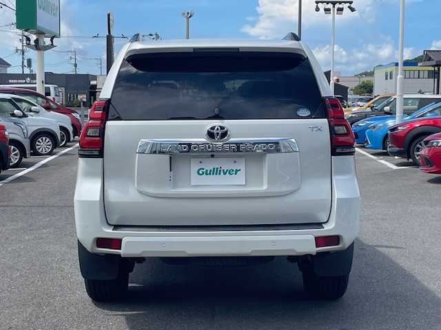 トヨタ ランドクルーザー プラド TX 長崎県 2018(平30)年 7.4万km ホワイトパールクリスタルシャイン 純正メモリーナビ/CD/DVD/BT/フルセグTV/バックカメラ/ウッドコンビハンドル（OP）/モデリスタフロントエアロ/トヨタセーフティセンス/レーダークルーズコントロール/レーンキープアシスト/ステアリングスイッチ/LEDヘッドライト/オートマチックハイビーム/ルーフレール/ドライブレコーダー/社外17インチAW/ビルトインETC