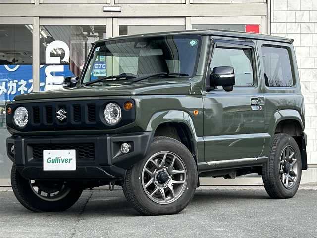 スズキ ジムニー XC 岩手県 2019(令1)年 1.5万km ジャングルグリーン ・4WD/・社外ナビ（CN-RZ743W）/・フルセグTV/・AM/FM/CD/DVD/SD/Bluetooth/・バックカメラ/・プッシュスタート/・スマートキー/・スペアキー1本/・横滑り防止/・ダウンヒルコントロール/・コーナーセンサー/・シートヒーター（前席）/・クルーズコントロール（追従無し）/・ETC/・5速MT/・電格ウィンカーミラー/・革巻きステアリング/・純正ドアバイザー/・純正AW16インチ