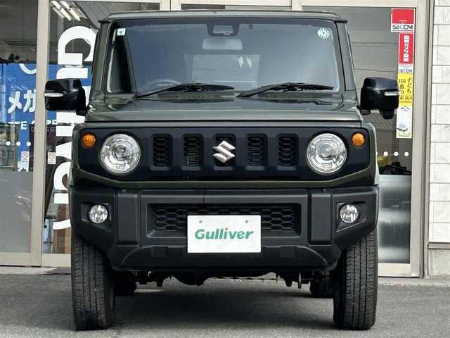 スズキ ジムニー XC 岩手県 2019(令1)年 1.5万km ジャングルグリーン ・4WD/・社外ナビ（CN-RZ743W）/・フルセグTV/・AM/FM/CD/DVD/SD/Bluetooth/・バックカメラ/・プッシュスタート/・スマートキー/・スペアキー1本/・横滑り防止/・ダウンヒルコントロール/・コーナーセンサー/・シートヒーター（前席）/・クルーズコントロール（追従無し）/・ETC/・5速MT/・電格ウィンカーミラー/・革巻きステアリング/・純正ドアバイザー/・純正AW16インチ