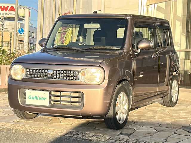 スズキ ラパン 10thアニバーサリーリミテッド 静岡県 2012(平24)年 9.4万km 茶 社外ナビ/シートヒーターD席/ETC/純正アルミホイール/純正フロアマット/スマートキー/スペアキー×１/プッシュスタート/オートエアコン/ハロゲンヘッドライト/Wエアバッグ/ABS/パワーウィンドウ/パワーステアリング