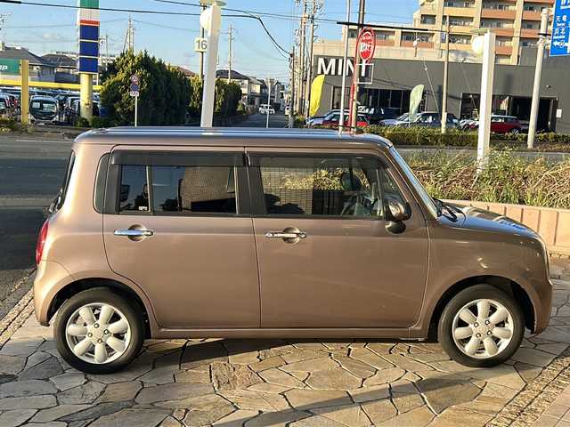 スズキ ラパン 10thアニバーサリーリミテッド 静岡県 2012(平24)年 9.4万km 茶 社外ナビ/シートヒーターD席/ETC/純正アルミホイール/純正フロアマット/スマートキー/スペアキー×１/プッシュスタート/オートエアコン/ハロゲンヘッドライト/Wエアバッグ/ABS/パワーウィンドウ/パワーステアリング