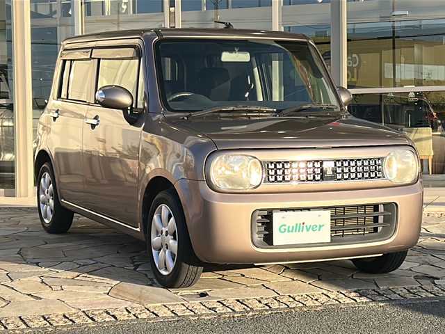 スズキ ラパン 10thアニバーサリーリミテッド 静岡県 2012(平24)年 9.4万km 茶 社外ナビ/シートヒーターD席/ETC/純正アルミホイール/純正フロアマット/スマートキー/スペアキー×１/プッシュスタート/オートエアコン/ハロゲンヘッドライト/Wエアバッグ/ABS/パワーウィンドウ/パワーステアリング