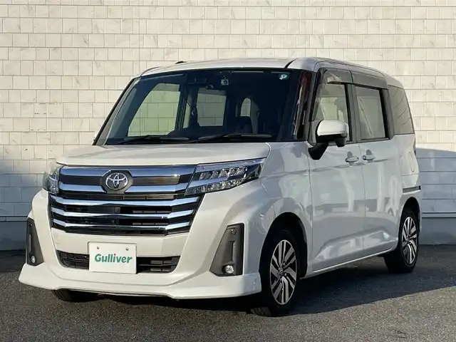 トヨタ ルーミー カスタムG 山口県 2023(令5)年 1.8万km パールホワイトⅢ SDナビ ワンセグTV CD BT/パノラミックビューモニター/両側パワースライドドア/前席シートヒーター/衝突被害軽減ブレーキ/レーダークルーズコントロール/レーンアシスト/オートマチックハイビーム/LEDオートヘッドライト/フォグライト/スマートキー 2個/前後ドラレコ/電動パーキングブレーキ/横滑り防止/ステアリングリモコン/革巻きステアリング/コーナーセンサー/禁煙車