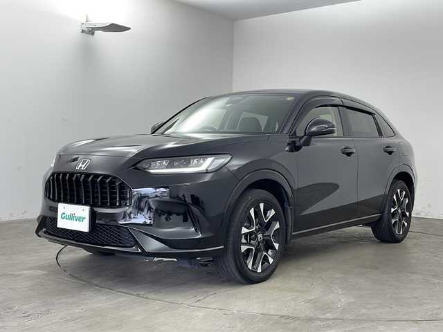 ホンダ ＺＲ－Ｖ ハイブリッド e:HEV Z 兵庫県 2023(令5)年 3.8万km クリスタルブラックパール ・Honda SENSING/・衝突軽減ブレーキ（CMBS）/・先行車発進お知らせ機能/・歩行者事故低減ステアリング/・路外逸脱抑制機能/・標識認識機能/・渋滞追従機能付アダプティブクルーズコントロール（ACC）/・車線維持支援システム（LKAS）/・トラフィックジャムアシスト（渋滞運転支援機能）/・ブラインドスポットインフォメーション/・誤発進抑制機能/・後方誤発進抑制機能/・近距離衝突軽減ブレーキ/・パーキングセンサーシステム/・アダプティブドライビングビーム/・マルチビューカメラシステム/・Honda CONNECTディスプレー/フルセグ/BT/USB/スマホ連携/・ビルトインETC2.0/・パドルシフト/・ステアリングヒーター/・ワイヤレス充電器/・本革シート/・前席パワーシート/・運転席＆助手席シートヒーター/・BOSEプレミアムサウンドシステム(12スピーカー)/・プラズマクラスター/・ハンズフリーアクセスパワーテールゲート/・18インチアルミホイール