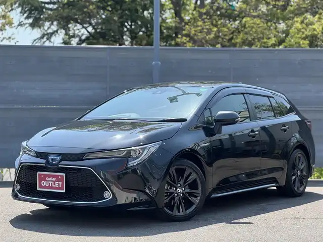トヨタ カローラツーリング ハイブリッド ダブルバイビー 三重県 2020(令2)年 3.8万km ブラックマイカ OP ブラインドスポットモニターセット/OP 9インチディスプレイオーディオ/6スピーカー/・コネクテッドナビ/・地デジTV/・Bluetooth/セーフティセンス/ドライブスタートコントロール/車両接近通報装置/バックカメラ/インテリジェントクリアランスソナー/コムテック前後ドライブレコーダー/レーダークルーズコントロール/レーンディパーチャーアラート/前席シートヒーター /ビルトインETC/純正17インチアルミホイール/丸型1灯式LEDヘッドランプ/・オートライト/オートマチックハイビーム/LEDフォグライト/プッシュエンジンスタート/スマートキー×2/新車時保証書/取扱説明書