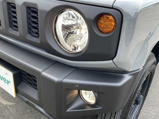 スズキ ジムニー XL 道東・釧路十勝 2024(令6)年 0.5万km ミディアムグレー 4WD/純正ナビ SKX-S808/　(AM/FM/CD/DVD/BT)/シートヒーター/純正16インチAW/純正フロアマット/ドアバイザー/アイドリングストップ/コーナーセンサー/レーンキープアシスト/ダウンヒルアシスト/オートライト/フォグランプ/盗難防止装置/ABS/横滑り防止装置/スペアキー/取扱説明書