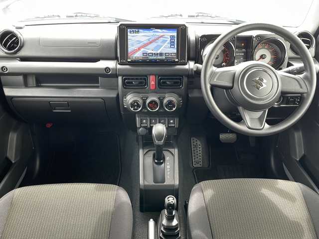 スズキ ジムニー XL 道東・釧路十勝 2024(令6)年 0.5万km ミディアムグレー 4WD/純正ナビ SKX-S808/　(AM/FM/CD/DVD/BT)/シートヒーター/純正16インチAW/純正フロアマット/ドアバイザー/アイドリングストップ/コーナーセンサー/レーンキープアシスト/ダウンヒルアシスト/オートライト/フォグランプ/盗難防止装置/ABS/横滑り防止装置/スペアキー/取扱説明書