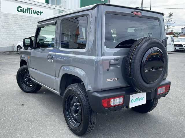 スズキ ジムニー XL 道東・釧路十勝 2024(令6)年 0.5万km ミディアムグレー 4WD/純正ナビ SKX-S808/　(AM/FM/CD/DVD/BT)/シートヒーター/純正16インチAW/純正フロアマット/ドアバイザー/アイドリングストップ/コーナーセンサー/レーンキープアシスト/ダウンヒルアシスト/オートライト/フォグランプ/盗難防止装置/ABS/横滑り防止装置/スペアキー/取扱説明書