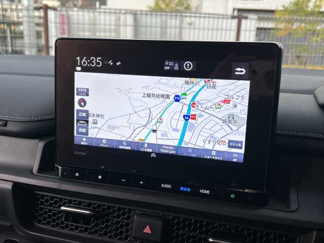 ホンダ ステップワゴン スパーダ eHEV 広島県 2023(令5)年 4.2万km クリスタルブラックパール 禁煙/ホンダセンシング/●衝突軽減ブレーキ（CMBS）/●誤発進抑制機能/●後方誤発進抑制機能/●近距離衝突軽減ブレーキ/●歩行者事故低減ステアリング/●路外逸脱抑制機能/●渋滞追従機能付アダプティブクルーズコントロール（ACC）/●車線維持支援システム（LKAS）/●トラフィックジャムアシスト（渋滞運転支援機能）/●先行車発進お知らせ機能/●標識認識機能/●オートハイビーム/●アダプティブドライビングビーム/BSi/コーナーセンサー/純正９型ナビ（LXM-237VFNi）/・フルセグTV/CD/DVD/Bluetooth/MusicRack/スマホ連携/USB/バックカメラ/両側パワースライドドア/ステアリングスイッチ/革巻きステアリング/パワーテールゲート/コンビシート/前席シートヒーター/２列目オットマン/減速セレクター/電動パーキングブレーキ/ブレーキホールド/トリプルゾーンエアコン/LEDアクティブコーナリングライト/LEDフォグランプ/ETC２．０/フロアマット/１６インチアルミホイール