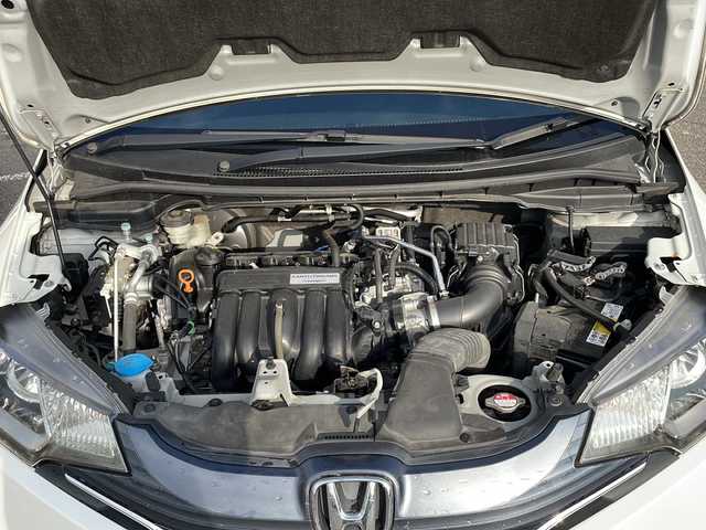 ホンダ フィット 13G Lパッケージ 新潟県 2013(平25)年 7.1万km プレミアムホワイトパール ４WD/純正メモリーナビ/(BT/AM/FM/ワンセグTV)/バックカメラ/社外15インチアルミ/ETC/電格ミラー/プッシュスタートエンジン/純正フロアマット/保証書/スペアキー