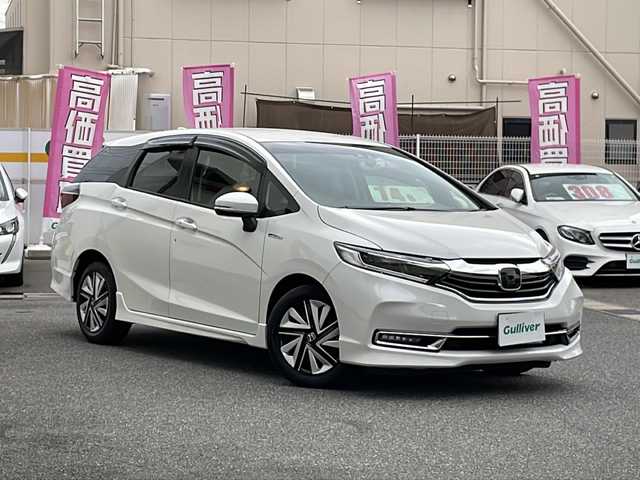 ホンダ シャトル ハイブリッド X ホンダセンシング 愛知県 2022(令4)年 2.4万km プラチナホワイトパール /禁煙//ワンオーナー//純正メモリナビ//フルセグ//CD/DVD/FM/AM/ipod/SD/USB/BT/AUX//バックカメラ//ホンダセンシング//ACC/LKAS/路外逸脱抑制/CMBS/誤発進抑制機能//パドルシフト//ビルトインETC//ハーフレザーシート//シートヒーター//前後ドライブレコーダー//オートリトラクタブルウィンカーミラー//LEDオートライト//フォグランプ//チップアップシート//防眩ミラー//ISOFIX//スポーツモード/エコモード//純正フロアマット/ドアバイザー//プッシュスタート//スマートキー//取扱説明書//保証書//記録簿R4-R7//スペアキー有