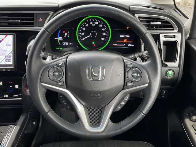 ホンダ シャトル ハイブリッド X ホンダセンシング 愛知県 2022(令4)年 2.4万km プラチナホワイトパール /禁煙//ワンオーナー//純正メモリナビ//フルセグ//CD/DVD/FM/AM/ipod/SD/USB/BT/AUX//バックカメラ//ホンダセンシング//ACC/LKAS/路外逸脱抑制/CMBS/誤発進抑制機能//パドルシフト//ビルトインETC//ハーフレザーシート//シートヒーター//前後ドライブレコーダー//オートリトラクタブルウィンカーミラー//LEDオートライト//フォグランプ//チップアップシート//防眩ミラー//ISOFIX//スポーツモード/エコモード//純正フロアマット/ドアバイザー//プッシュスタート//スマートキー//取扱説明書//保証書//記録簿R4-R7//スペアキー有