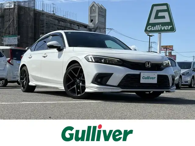 ホンダ シビック EX 大分県 2021(令3)年 5.5万km プラチナホワイトパール ・ナビ(BT/USB/apple)/・純正リアスポイラー/・無限マフラー/・BOSE/・バックカメラ/・フルセグテレビ/・ホンダセンシング/・ブラインドスポットモニター/・コーナーセンサー/・レーダークルーズコントロール/・パワーシート/・シートヒーター/・ETC 2.0/・ブレーキホールド/・置くだけ充電/・ドライブレコーダー/・スマートキー/・プッシュスタート