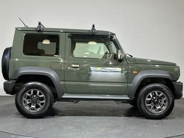 スズキ ジムニー シエラ JC 愛媛県 2024(令6)年 0.4万km ジャングルグリーン ・衝突軽減ブレーキ/・レーンアシスト/・社外メモリーナビ/・フルセグテレビ/Bluetooth/USB/・バックカメラ/・ドライブレコーダー/・ETC/・シートヒーター/・シートカバー/・クルーズコントロール/・スマートキー/・LEDヘッドライト