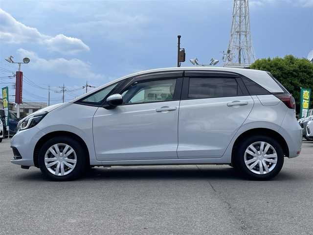 ホンダ フィット e:HEVホーム 群馬県 2022(令4)年 1.8万km プレミアムサンライトホワイトパール 純正９インチナビ　/バックカメラ　/フルセグＴＶ・Ｂｌｕｅｔｏｏｔｈ　　/衝突軽減ブレーキ　/コーナーセンサー　/クルーズコントロール　/電動パーキング　/ＬＥＤライト　/前後純正ドライブレコーダー　/前席シートヒーター　/ＥＴＣ