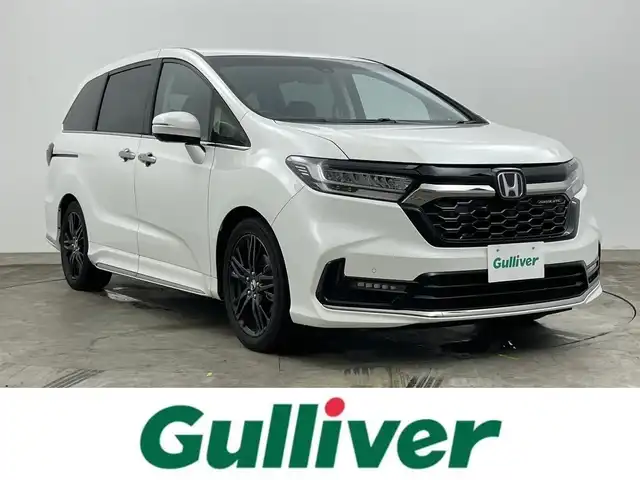 ホンダ オデッセイ ハイブリッド e:HEVアブソルート EX 岡山県 2020(令2)年 7万km プラチナホワイトパール 純正１０インチナビ/【Bluetooth/CD/USB/TV/DVD】　/純正１１．６インチフリップダウンモニター　/両側電動スライド　/アラウンドビューモニター　/レーダークルーズコントロール　/１００Ｖ電源　/ビルトインＥＴＣ２．０　/シートヒーター　/ＬＥＤヘッドライト/踏み間違い防止/オートブレーキホールド/BSM/ISOFIX/リアサーキュレーター/ステアリングスイッチ/チルトステアリング/シートリフター/ウィンカーミラー