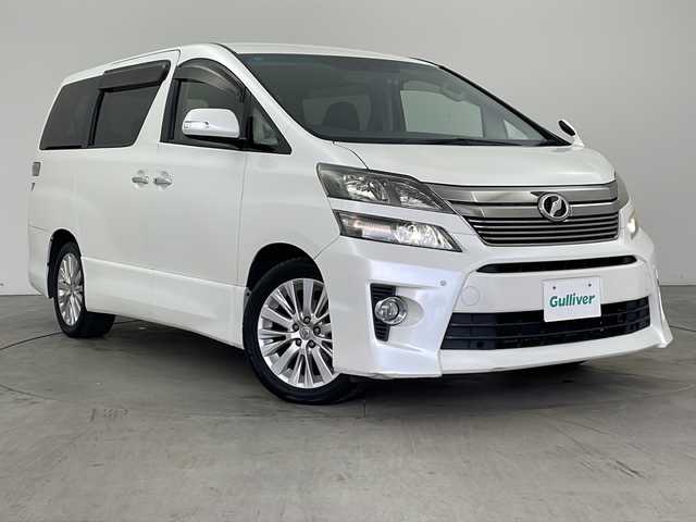 トヨタ ヴェルファイア 2．4Z 兵庫県 2012(平24)年 10.6万km ホワイトパールクリスタルシャイン ・純正ナビ/CD/DVD/MSV/BT/TV/・バックカメラ/・前方ドライブレコーダー/・左右独立エアコン/・MTモード付AT/・ビルトインETC/・革巻ステアリング/・ステアリングスイッチ/・nanoe/・クリアランスソナー/・両側パワースライドドア/・トランクイージークローザー/・オールオートパワーウィンドウ/・横滑り防止装置/・ウインカーミラー/・プッシュスタート/・後席エアコン/・HIDヘッドライト/・フォグランプ/・電動格納ミラー/・スマートキー/・スペアキー/・純正フロアマット/・純正アルミホイール/・取扱説明書/・保証書