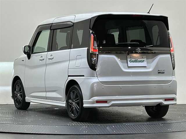 スズキ ソリオ HV SZ 愛媛県 2023(令5)年 0.8万km ピュアホワイトP ・８型ナビ（フルセグＴＶ・ＢＴ・ＣＤＤＶＤ・ＦＭＡＭ・ＳＤ）/・全方位カメラ　/・ＥＴＣ　/・両側電動ドア　/・レーダークルーズコントロール　/・前後コーナーセンサー　/・レーンキープアシスト　/・ＤＮ席シートヒーター　/・ＵＳＢ充電/・衝突軽減/・ヘッドアップディスプレイ