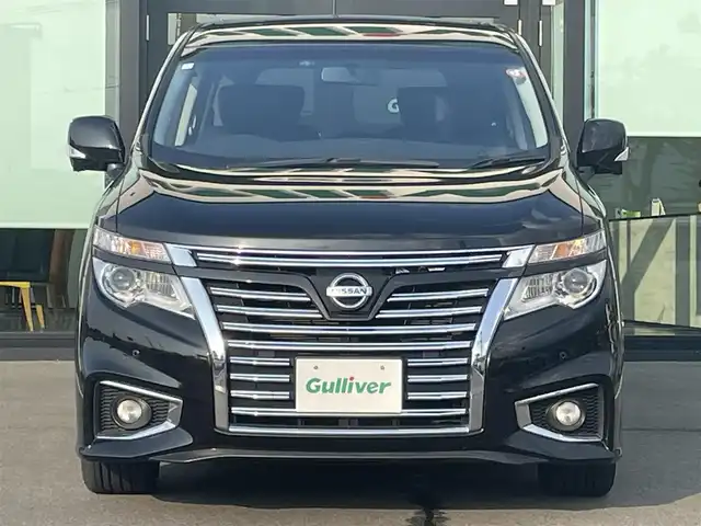 日産 エルグランド 250ハイウェイスター 愛媛県 2015(平27)年 6.4万km ファントムブラック 純正ナビ（Bluetooth/CD/DVD/AUX/フルセグTV)/リアエンターテインメント/バックカメラ/ビルドインETC/前方ドライブレコーダー/両側パワースライドドア/ハーフレザーシート/オットマン/100V充電/クルーズコントロール/純正18インチアルミホイール/純正フロアマット/純正ドアバイザー/LEDヘッドライト/フォグランプ/ABS/横滑り防止装置