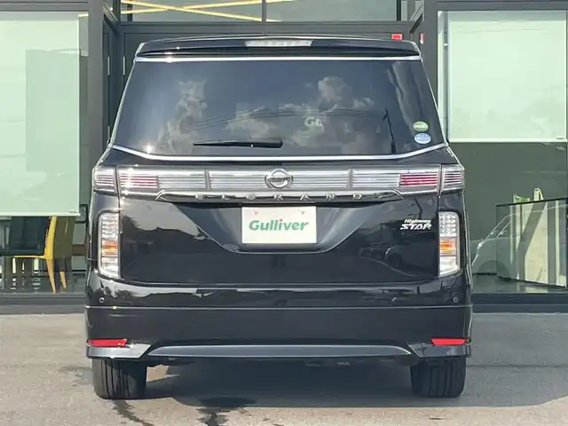 日産 エルグランド 250ハイウェイスター 愛媛県 2015(平27)年 6.4万km ファントムブラック 純正ナビ（Bluetooth/CD/DVD/AUX/フルセグTV)/リアエンターテインメント/バックカメラ/ビルドインETC/前方ドライブレコーダー/両側パワースライドドア/ハーフレザーシート/オットマン/100V充電/クルーズコントロール/純正18インチアルミホイール/純正フロアマット/純正ドアバイザー/LEDヘッドライト/フォグランプ/ABS/横滑り防止装置