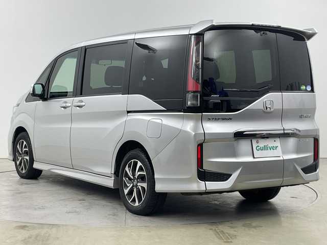 ホンダ ステップワゴン スパーダ ホンダセンシング 道央・札幌 2019(平31)年 8.6万km スーパープラチナメタリック ・４WD/ホンダセンシング/・衝突軽減ブレーキ〈CMBS〉/・LKAS〈車線維持支援システム〉/・レーダークルーズコントロール/・純正9インチインターナビ/・DVD.CD.SD.BT.フルセグ/・マルチビューカメラシステム/・両側パワースライドドア/・リアドアわくわくゲート/・フロントワイパーデアイサー/・LEDライト/オートハイビーム/・ミラーヒーター/・ビルとインETC/・スタッドレスタイヤ積込み有/・スマートキーｘ２