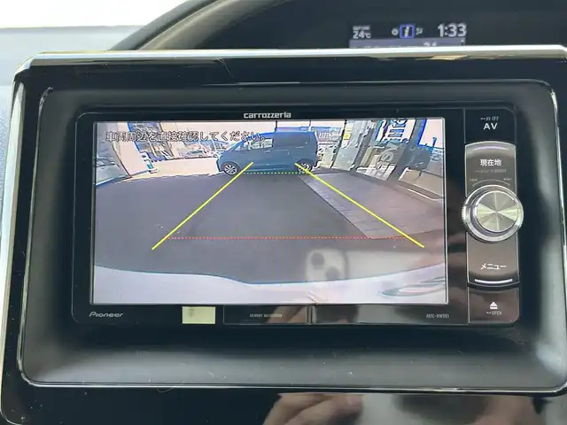 トヨタ ヴォクシー ハイブリッド ZS 煌 福島県 2018(平30)年 9.4万km ホワイトパールクリスタルシャイン 登録時走行距離：93/676km/社外SDナビ/（フルセグTV/BT接続/AM/FM/CD/DVD）/社外フリップダウンモニター/両側パワースライドドア/バックカメラ/ETC/PUSHスタート/シートヒーター（D/N席）/クルーズコントロール/ステアリングスイッチ/ドライブレコーダー/電格ミラー/ウィンカーミラー/オートライト/オートハイビーム/LEDヘッドライト/フォグランプ/純正フロアマット/社外AW/スマートキー/スペアキー/ドアバイザー/サマータイヤ4本/レーンキープ/車両接近通報装置/衝突被害軽減ブレーキ/横滑り防止装置/三列シート/ウォークスルー/保証書/取扱説明書