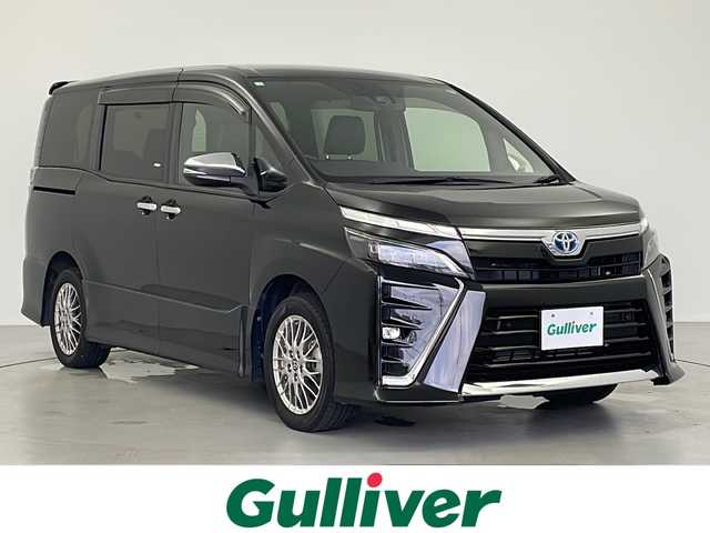 トヨタ ヴォクシー ハイブリッド ZS 煌Ⅲ 岐阜県 2020(令2)年 4.1万km イナズマスパーキングブラックガラスフレーク 純正９インチナビ　NSZT-Y68T/CD/DVD/Bluetooth/フルセグTV/バックカメラ　/両側パワースライドドア　/衝突軽減ブレーキ　/レーンキープアシスト　/クリアランスソナー　/パーキングサポートブレーキ　/先行車発進通知　/オートLEDライト　/オートハイビーム　/クルーズコントロール　/ETC　/前後ドライブレコーダー/ハーフレザー調シート　/前席シートヒーター/ステアリングスイッチ/純正１６インチアルミホイール