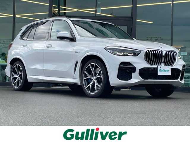 ＢＭＷ ＢＭＷ Ｘ５ xDrive 45e Mスポーツ 東京都 2023(令5)年 11.2万km ミネラルホワイト ・法人ワンオーナー/・エアササスペンション/・プッシュスタート/・パノラマサンルーフ/・インテリジェントセーフティ/・注意喚起アシスタント/・ステアリングアシスト/・PDC自動起動/・アクティブPDC緊急ブレーキ/・パーキングアシスト/・ハイビームアシスト/・クルーズコントロール(追従式)/・本革シート/・前席パワーシート/・全席シートヒーター/・純正メモリナビ/【Bluetooth・USB・AppleCarPlay】/・フルセグTV/・全方位カメラ/・ETC/・ワイヤレス充電/・ドライブレコーダー(前後録画)/・レーダー探知機/・パワーバックドア/・LEDヘッドランプ/・純正マット