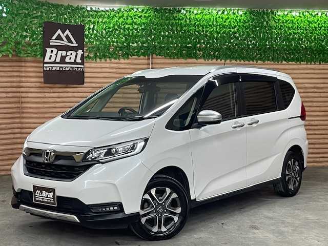 ホンダ フリード＋ クロスター ホンダセンシング 道央・札幌 2021(令3)年 5.4万km プラチナホワイトパール ４ＷＤ/ホンダセンシング　/社外ナビ　/バックカメラ　/両側電動スライドドア　/純正エンジンスターター　/純正１５インチアルミホイール　/レーダークルーズ/ドライブレコーダー　/前席シートヒーター　/ハーフレザーシート　/コーナーセンサー　/ＬＥＤヘッドライト/ビルトインETC