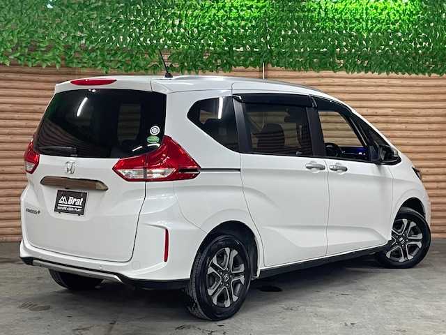 ホンダ フリード＋ クロスター ホンダセンシング 道央・札幌 2021(令3)年 5.4万km プラチナホワイトパール ４ＷＤ/ホンダセンシング　/社外ナビ　/バックカメラ　/両側電動スライドドア　/純正エンジンスターター　/純正１５インチアルミホイール　/レーダークルーズ/ドライブレコーダー　/前席シートヒーター　/ハーフレザーシート　/コーナーセンサー　/ＬＥＤヘッドライト/ビルトインETC