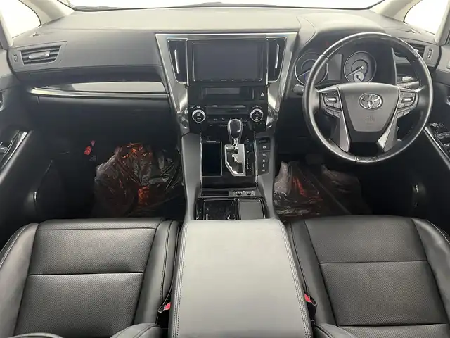 トヨタ アルファードハイブリット SR Cパッケージ 福島県 2019(令1)年 2.3万km ホワイトパールクリスタルシャイン フリップダウンモニター/・純正SDナビゲーション/型式：NSZt-Y68T/【CD/DVD/Bluetooth/フルセグTV】/・バックカメラ/・ETC2.0/・前後ドライブレコーダー/プリクラッシュセーフティ/レーントレーシングアシスト/アダプティブクルーズコントロール/クリアランスソナー/パーキングサポートブレーキ/ロードサインアシスト/電子パーキングブレーキ/・ブレーキオートホールド/アイドリングストップ/両側パワースライドドア/・パワーバックドア/コンビステアリング/・ステアリングスイッチ/・ステアリングヒーター/レザーシート/・運転席＋助手席パワーシート/・運転席メモリーシート/・運転席＋助手席シートヒーター/・運転席＋助手席エアシート/・オットマン/LEDヘッドライト/・オートライト/・フロントフォグライト/ABS/横滑り防止装置/盗難防止装置/純正フロアマット/ドアバイザー/プッシュスタート/・スマートキー/・スペアキー