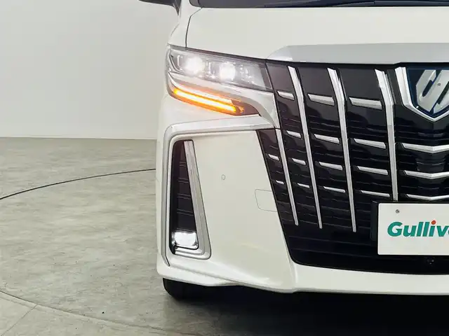 トヨタ アルファードハイブリット SR Cパッケージ 福島県 2019(令1)年 2.3万km ホワイトパールクリスタルシャイン フリップダウンモニター/・純正SDナビゲーション/型式：NSZt-Y68T/【CD/DVD/Bluetooth/フルセグTV】/・バックカメラ/・ETC2.0/・前後ドライブレコーダー/プリクラッシュセーフティ/レーントレーシングアシスト/アダプティブクルーズコントロール/クリアランスソナー/パーキングサポートブレーキ/ロードサインアシスト/電子パーキングブレーキ/・ブレーキオートホールド/アイドリングストップ/両側パワースライドドア/・パワーバックドア/コンビステアリング/・ステアリングスイッチ/・ステアリングヒーター/レザーシート/・運転席＋助手席パワーシート/・運転席メモリーシート/・運転席＋助手席シートヒーター/・運転席＋助手席エアシート/・オットマン/LEDヘッドライト/・オートライト/・フロントフォグライト/ABS/横滑り防止装置/盗難防止装置/純正フロアマット/ドアバイザー/プッシュスタート/・スマートキー/・スペアキー