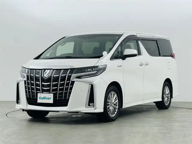 トヨタ アルファードハイブリット SR Cパッケージ 福島県 2019(令1)年 2.3万km ホワイトパールクリスタルシャイン フリップダウンモニター/・純正SDナビゲーション/型式：NSZt-Y68T/【CD/DVD/Bluetooth/フルセグTV】/・バックカメラ/・ETC2.0/・前後ドライブレコーダー/プリクラッシュセーフティ/レーントレーシングアシスト/アダプティブクルーズコントロール/クリアランスソナー/パーキングサポートブレーキ/ロードサインアシスト/電子パーキングブレーキ/・ブレーキオートホールド/アイドリングストップ/両側パワースライドドア/・パワーバックドア/コンビステアリング/・ステアリングスイッチ/・ステアリングヒーター/レザーシート/・運転席＋助手席パワーシート/・運転席メモリーシート/・運転席＋助手席シートヒーター/・運転席＋助手席エアシート/・オットマン/LEDヘッドライト/・オートライト/・フロントフォグライト/ABS/横滑り防止装置/盗難防止装置/純正フロアマット/ドアバイザー/プッシュスタート/・スマートキー/・スペアキー
