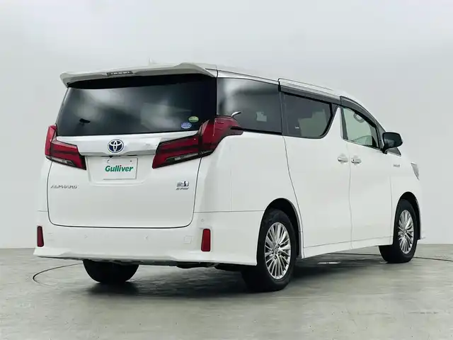 トヨタ アルファードハイブリット SR Cパッケージ 福島県 2019(令1)年 2.3万km ホワイトパールクリスタルシャイン フリップダウンモニター/・純正SDナビゲーション/型式：NSZt-Y68T/【CD/DVD/Bluetooth/フルセグTV】/・バックカメラ/・ETC2.0/・前後ドライブレコーダー/プリクラッシュセーフティ/レーントレーシングアシスト/アダプティブクルーズコントロール/クリアランスソナー/パーキングサポートブレーキ/ロードサインアシスト/電子パーキングブレーキ/・ブレーキオートホールド/アイドリングストップ/両側パワースライドドア/・パワーバックドア/コンビステアリング/・ステアリングスイッチ/・ステアリングヒーター/レザーシート/・運転席＋助手席パワーシート/・運転席メモリーシート/・運転席＋助手席シートヒーター/・運転席＋助手席エアシート/・オットマン/LEDヘッドライト/・オートライト/・フロントフォグライト/ABS/横滑り防止装置/盗難防止装置/純正フロアマット/ドアバイザー/プッシュスタート/・スマートキー/・スペアキー