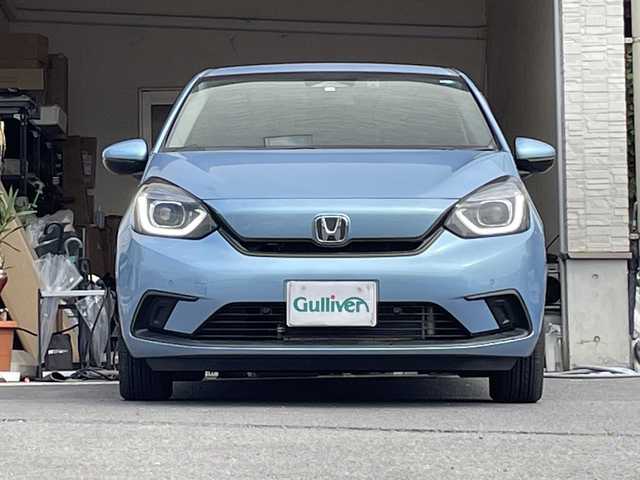 ホンダ フィット ホーム 大分県 2022(令4)年 0.7万km ライトブルー ワンオーナー /純正ナビ/Bluetooth/純正LEDヘッドライト/オートライト/純正フロアマット/ドラレコ/衝突被害軽減ブレーキ/横滑り防止装置/ドラレコ/バックカメラ/クルーズコントロール