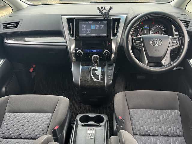 トヨタ ヴェルファイア Z 沖縄県 2016(平28)年 5.1万km ホワイトパールクリスタルシャイン 純正ナビ・TV・Bluetooth・CD・DVD/フリップダウンモニター/両側パワースライドドア/バックカメラ/ETC/コーナーセンサー/オートライト/電子サイドブレーキ/オートホールド/電動格納ミラー