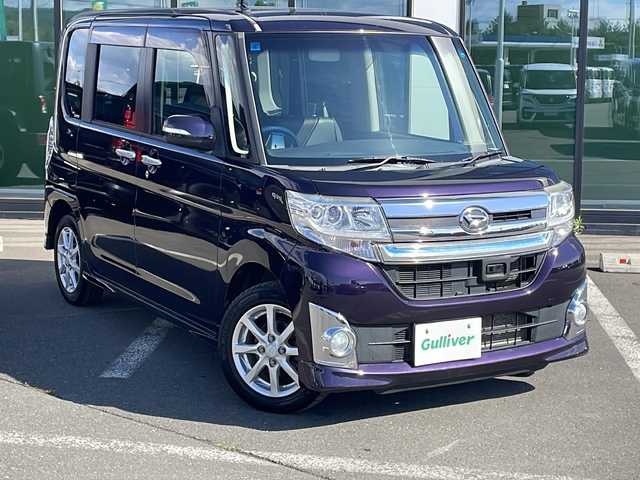 ダイハツ タント カスタム X トップED SA 道東・釧路十勝 2015(平27)年 6万km ナイトシャドーパープルクリスタルM ・4WD/・純正8インチナビ/（AM・FM・CD・DVD・ipod・SD・フルセグ）/・バックモニター/・片側パワースライドドア/・後席純正フリップダウンモニター/・スマートアシスト/・低速域衝突回避支援ブレーキ機能/・誤発信抑制御機能j/・先行車発信お知らせ機能/・アイドリングストップ機能/・LEDヘッドランプ/・オートライト/・ステアリングスイッチ/・オートエアコン/・リアヒーターダクト/・皮ファブリックコンビシート/・シートリフター/・イモビライザー/・スマートキー/・プッシュスタート/・純正14インチアルミホイール