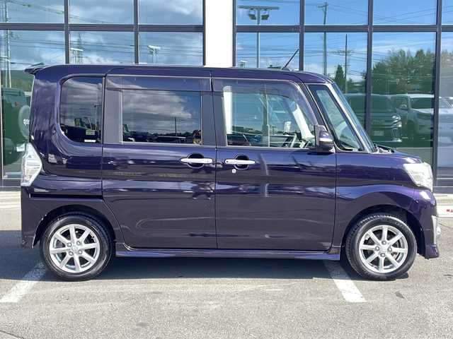 ダイハツ タント カスタム X トップED SA 道東・釧路十勝 2015(平27)年 6万km ナイトシャドーパープルクリスタルM ・4WD/・純正8インチナビ/（AM・FM・CD・DVD・ipod・SD・フルセグ）/・バックモニター/・片側パワースライドドア/・後席純正フリップダウンモニター/・スマートアシスト/・低速域衝突回避支援ブレーキ機能/・誤発信抑制御機能j/・先行車発信お知らせ機能/・アイドリングストップ機能/・LEDヘッドランプ/・オートライト/・ステアリングスイッチ/・オートエアコン/・リアヒーターダクト/・皮ファブリックコンビシート/・シートリフター/・イモビライザー/・スマートキー/・プッシュスタート/・純正14インチアルミホイール