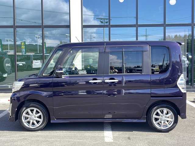 ダイハツ タント カスタム X トップED SA 道東・釧路十勝 2015(平27)年 6万km ナイトシャドーパープルクリスタルM ・4WD/・純正8インチナビ/（AM・FM・CD・DVD・ipod・SD・フルセグ）/・バックモニター/・片側パワースライドドア/・後席純正フリップダウンモニター/・スマートアシスト/・低速域衝突回避支援ブレーキ機能/・誤発信抑制御機能j/・先行車発信お知らせ機能/・アイドリングストップ機能/・LEDヘッドランプ/・オートライト/・ステアリングスイッチ/・オートエアコン/・リアヒーターダクト/・皮ファブリックコンビシート/・シートリフター/・イモビライザー/・スマートキー/・プッシュスタート/・純正14インチアルミホイール