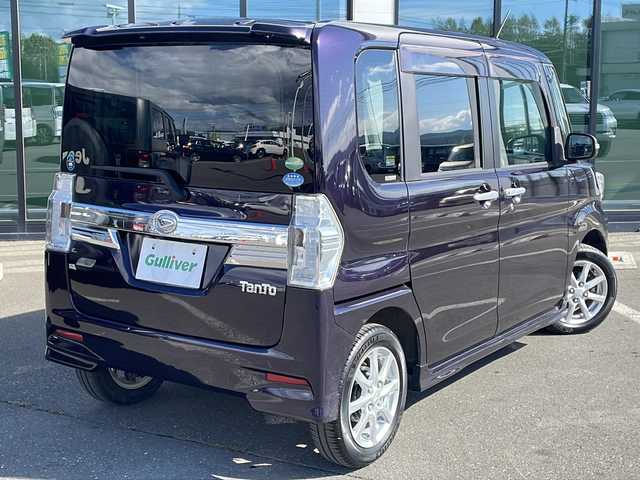 ダイハツ タント カスタム X トップED SA 道東・釧路十勝 2015(平27)年 6万km ナイトシャドーパープルクリスタルM ・4WD/・純正8インチナビ/（AM・FM・CD・DVD・ipod・SD・フルセグ）/・バックモニター/・片側パワースライドドア/・後席純正フリップダウンモニター/・スマートアシスト/・低速域衝突回避支援ブレーキ機能/・誤発信抑制御機能j/・先行車発信お知らせ機能/・アイドリングストップ機能/・LEDヘッドランプ/・オートライト/・ステアリングスイッチ/・オートエアコン/・リアヒーターダクト/・皮ファブリックコンビシート/・シートリフター/・イモビライザー/・スマートキー/・プッシュスタート/・純正14インチアルミホイール