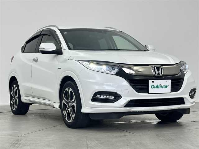 ホンダ ヴェゼル ハイブリッド Z ホンダセンシング 愛知県 2021(令3)年 4.5万km プラチナホワイトパール ・純正9インチナビ/・Bluetooth/・バックカメラ/・フルセグTV/・ホンダセンシング/・衝突被害軽減システム/・クルーズコントロール/・コーナーセンサー/・レーンキープアシスト/・オートライト/・LEDフォグランプ/・シートヒーター/・ETC/・純正AW/・純正フロアマット/・プッシュスタート/・スマートキー